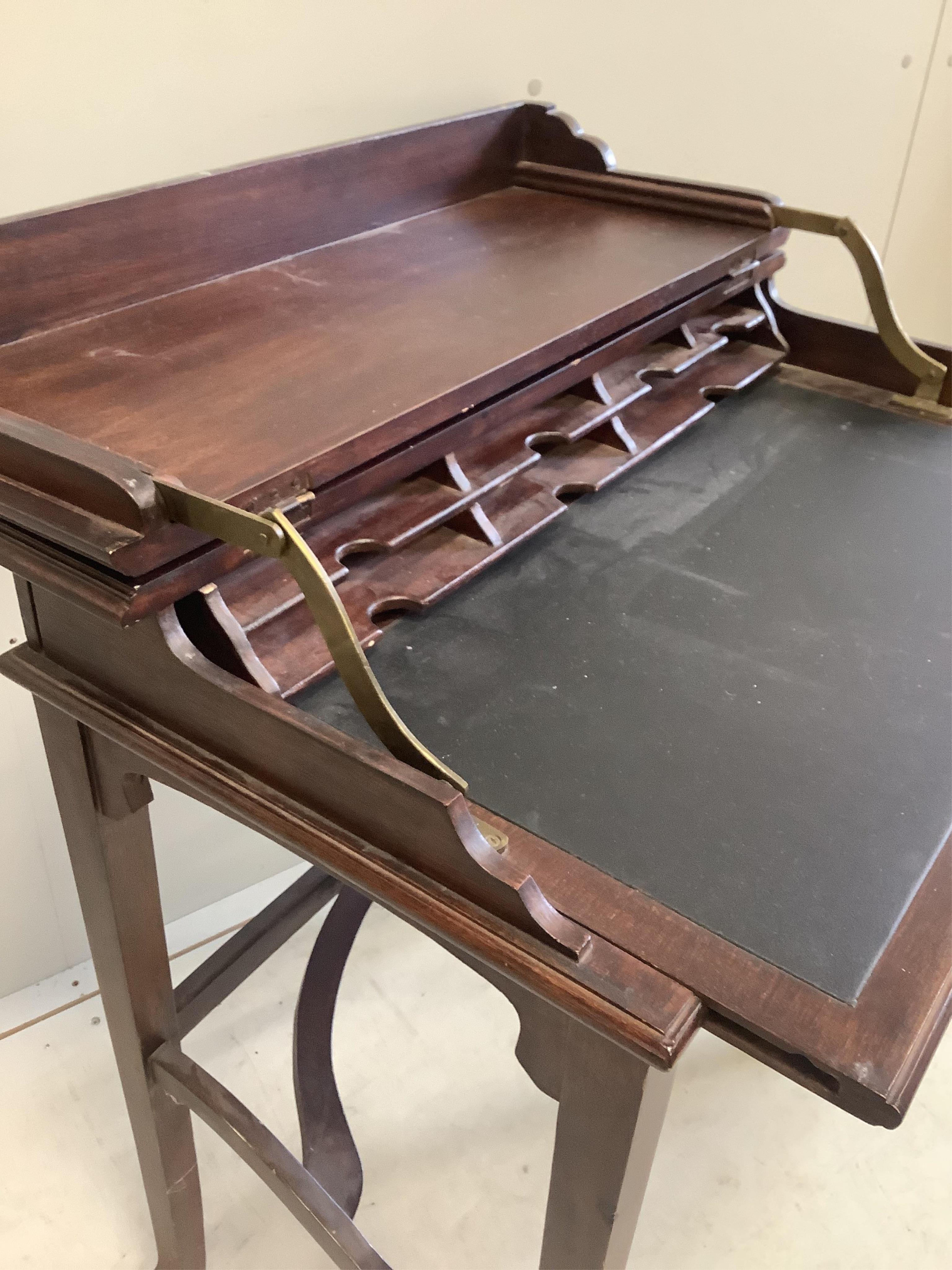 A reproduction OKA hardwood writing table, width 75cm, depth 43cm, height 80cm. Condition - fair